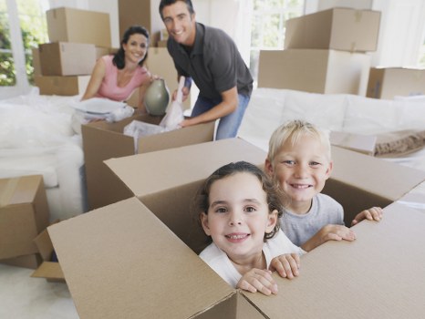 Moving boxes and furniture being loaded during a Swiss Cottage removal