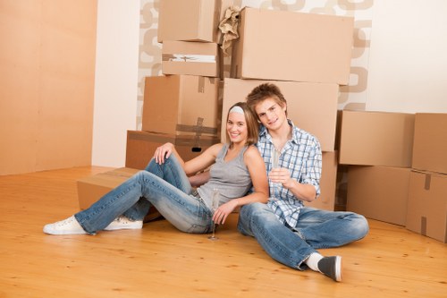 Packed boxes and furniture ready for removals transport in Swiss Cottage