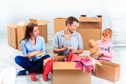 Loading household items into a removals van