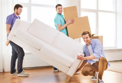 Moving checklist and boxed belongings ready for collection in Swiss Cottage
