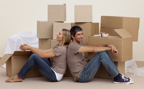 Van loading boxes and household items for a Swiss Cottage move