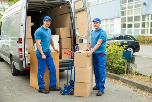 Removal workers following a health and safety procedure