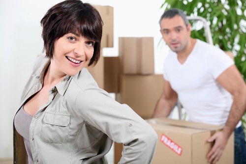 Packed boxes and furniture ready for a home move in Swiss Cottage flat