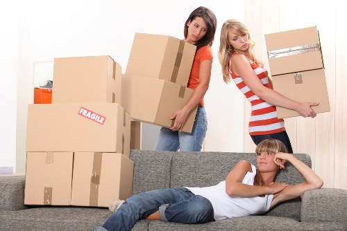 Furniture and boxes being moved by a local removal team